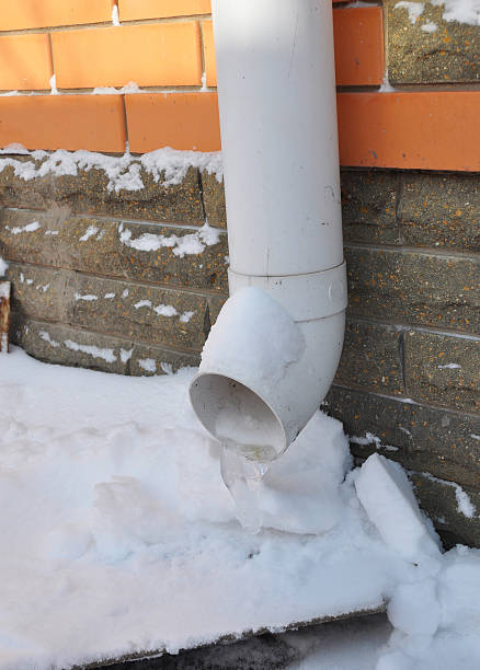 istock Gutters and Downspouts Sometimes Freeze into Solid Blocks of Ice. 505961218