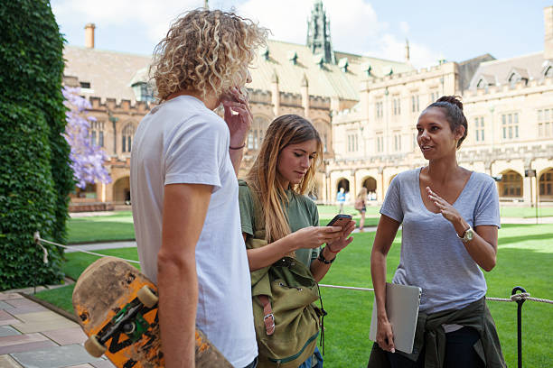 university students Urban students hanging out, waiting for class outside the university. university students australia stock pictures, royalty-free photos & images