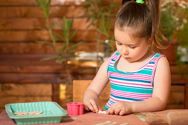 istock Little girl playing with dough 505962366