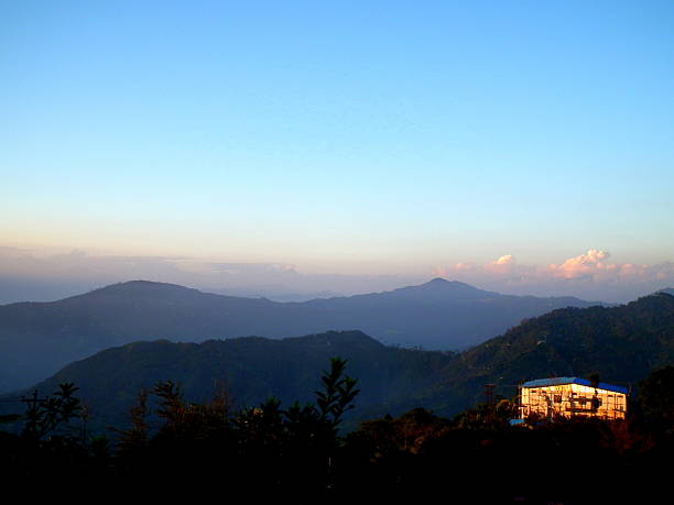 Mountain Scenary at the Himalayas The Kanchenjunga (in the Himalayas) is the third highest mountain in the world with an elevation of 8,586 m (28,169 ft) and lies partly in Nepal and partly in Sikkim, India. tiger hill stock pictures, royalty-free photos & images