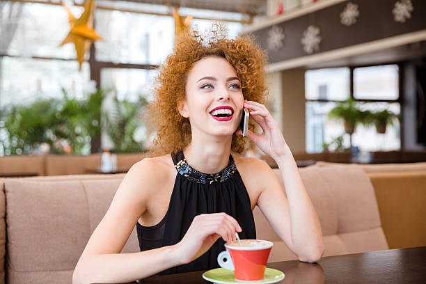 istock Woman talking on the phone in restaurant 505962944