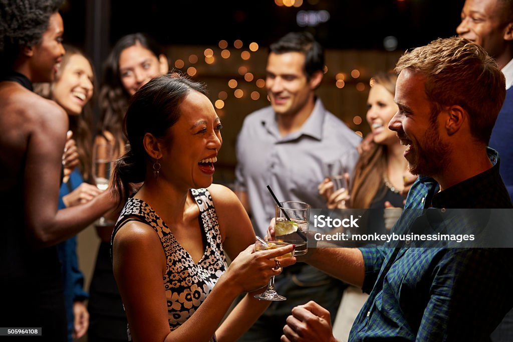 Couples Dancing And Drinking At Evening Party Party - Social Event Stock Photo