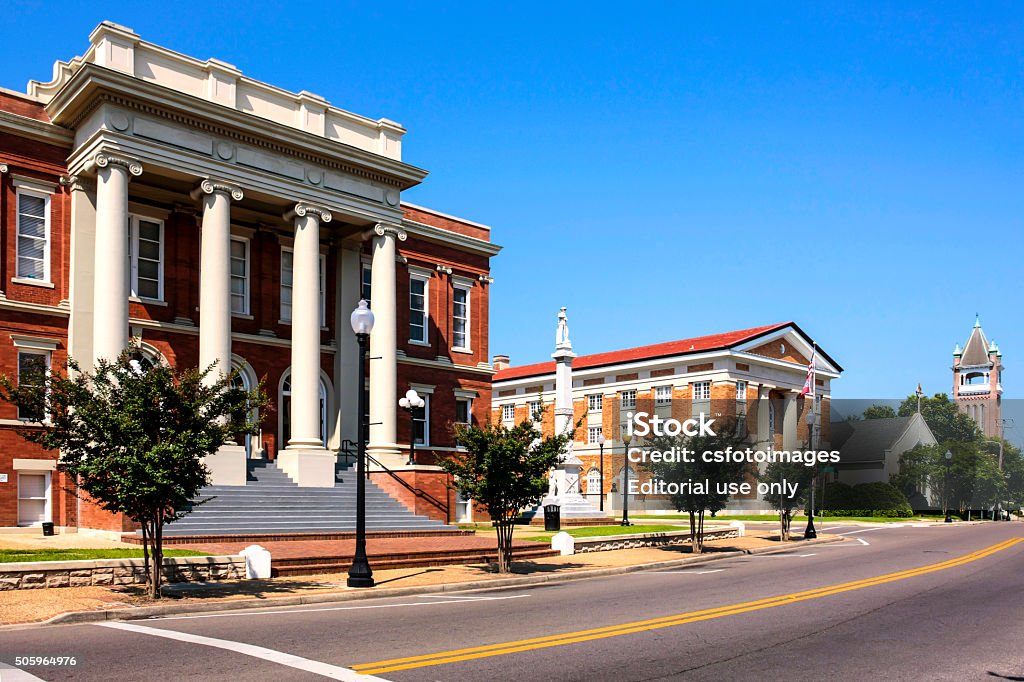 Buildings in the historic district of Hattiesburg MS Hattiesburg, MS, USA - June 6th, 2015: The Forest County Courthouse and to the right, the Confederate war memorial, the masonic temple and Christian church, all in the historic distric of Hattiesburg, Mississippi Hattiesburg Stock Photo