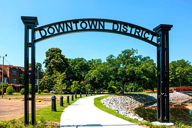 Downtown District overhead black metal framed sign in Hattiesburg MS stock photo