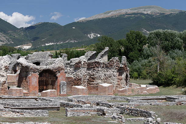 Amiternum, province of L'Aquila, Abruzzo region, Italy. The amphitheater of Amiternum preceded by the remains of a large domus. Amiternum was a very important Roman town of the Augustan age, birthplace of  Sallustius, Roman polician and historian. Amiternum, today near L'Aquila, was residential mountain town of the Roman ruling class .