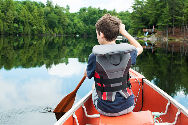 少年、カヌー - canoeing paddling canoe adventure ストックフォトと画像