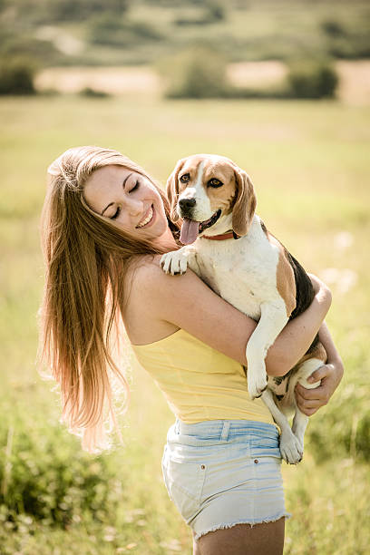 istock Young woman with her dog 505967336