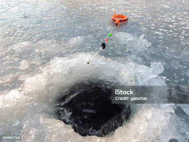Winter Fishing From The Ice Stock Photo - Download Image Now - Adult, Blue, Canada