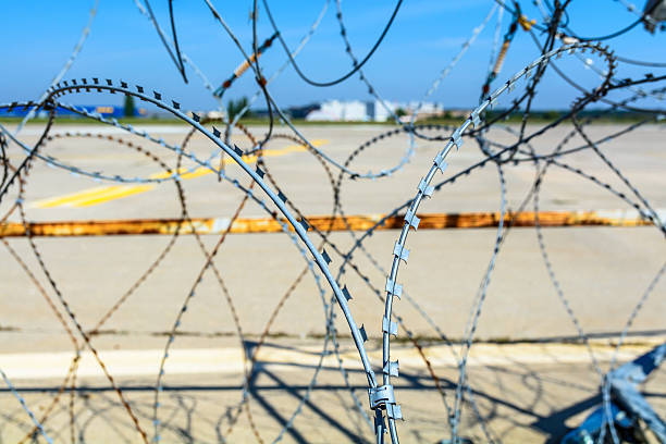istock Close-up of a barbed wire fence. 505970052