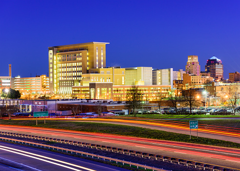 Durham, North Carolina, USA downtown city skyline and highway.
