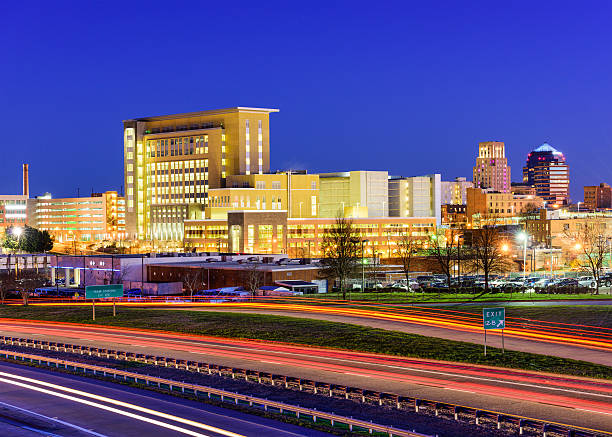 Durham, North Carolina Durham, North Carolina, USA downtown city skyline and highway. durham north carolina stock pictures, royalty-free photos & images
