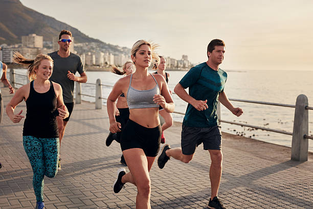 istock Group of young people doing running workout 505970948