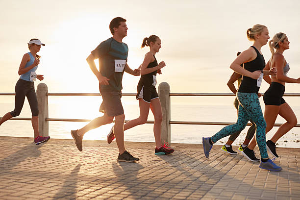 istock Group of young people competing in a race 505971374