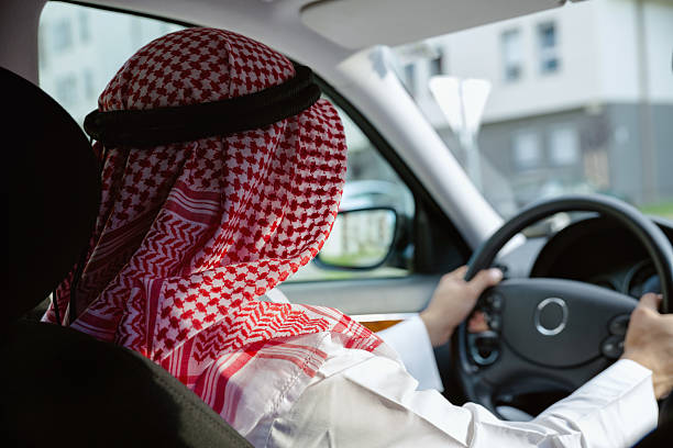 arabian in auto - car driving businessman hands free device foto e immagini stock