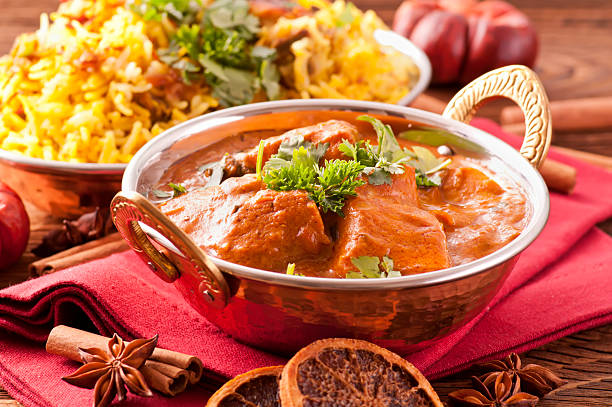 Chicken Biryani Indian meal Biryani with saffron rice as closeup in traditional bowls karahi stock pictures, royalty-free photos & images