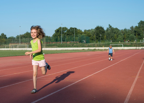 children running on the track
