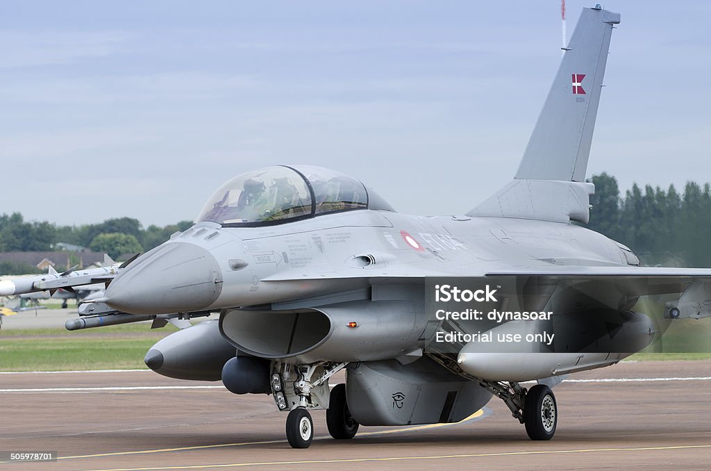 Lockheed Martin F-16D Fighting Falcon Fairford, United Kingdom - July 11, 2014: Danish Air Force F-16D multirole fighter aircraft preparing to take off at an airshow. The Lockheed Martin F-16D Fighting Falcon is a jet fighter aircraft that currently flown by the US and 25 other nations. It has participated in various conflicts. Military Stock Photo