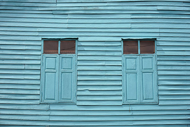 istock Vintage Blue Wooden Wall And Window 505980425