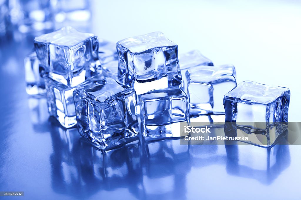 Ice cubes on blue background Ice cubes Abstract Stock Photo