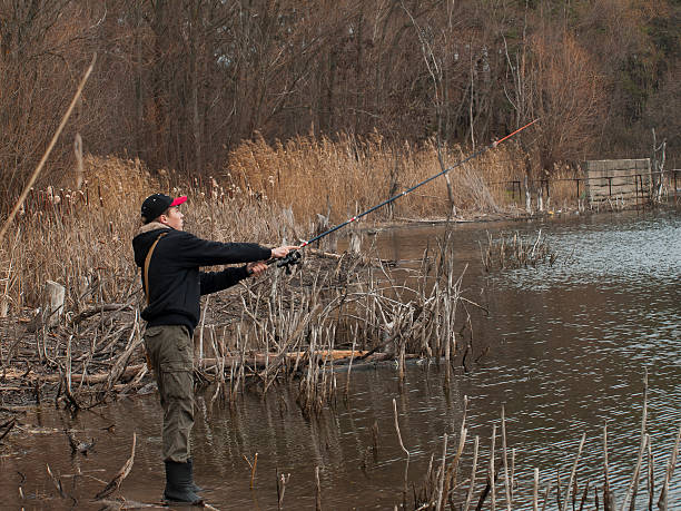 istock Young angler fishing spinning 505983179