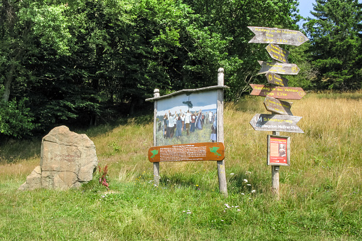 Lichtenau, Germany - August 7, 2012: Hiking signpost and historic table of Freideutscher Jugendtag 1913 at Hohen Meissner, Lichtenau, Hessen