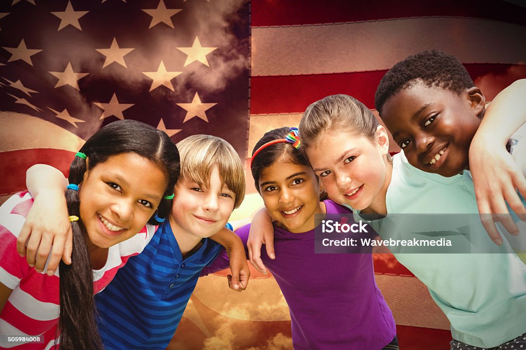 Composite image of happy children forming huddle at park Happy children forming huddle at park against composite image of digitally generated united states national flag Child Stock Photo