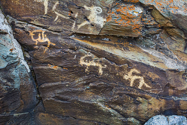 istock Hunting scenes prehistorical petroglyphs 505984178