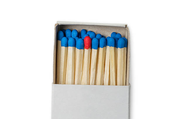 istock Matchbox with blue and one red matches 505984610