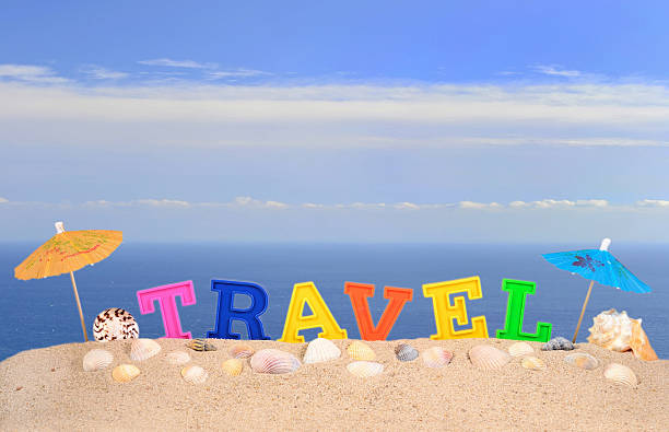 istock Travel letters on a beach sand 505984868