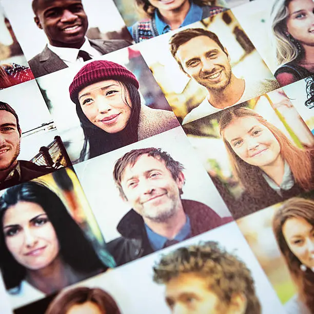 Photo of Outlay of multiracial faces printed