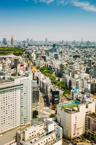 Tokyo's cityscape towards Shibuya and Shinjuku. Famous Shibuya croossroad in the center,