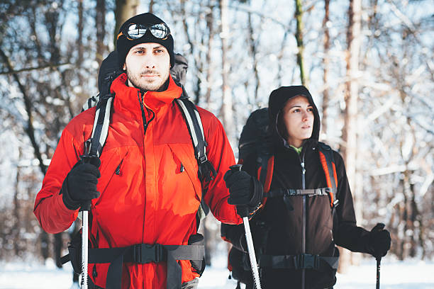 istock Man and woman hiking together 505986200