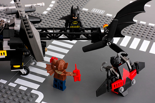 Tambov, Russian Federation - May 27, 2015: Lego Batman on Batcopter with Nightwing and Man-Bat on the street. Studio shot.