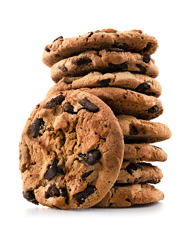 Pile of chocolate chip cookies against white background. 