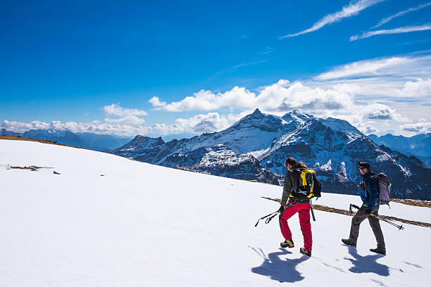 istock Hikers walking on snow-covered field at high altitude 505988666