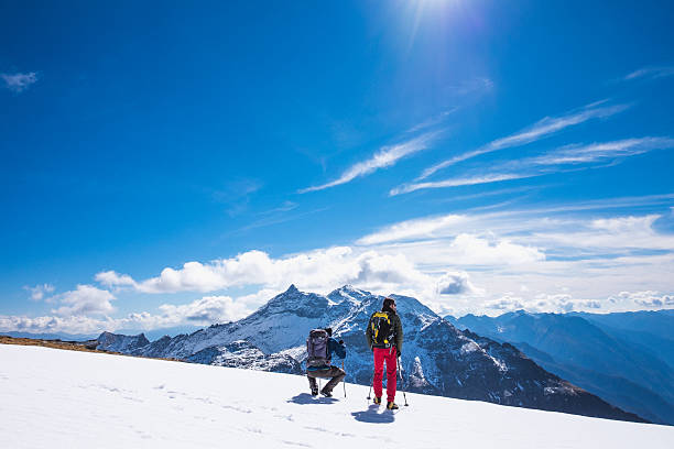 istock Hikers on snow-covered field at high altitude 505988746