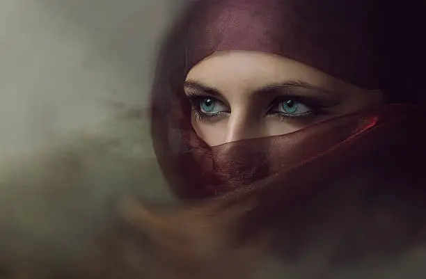 Young arabian woman in hijab with sexy blue eyes. Yashmak.