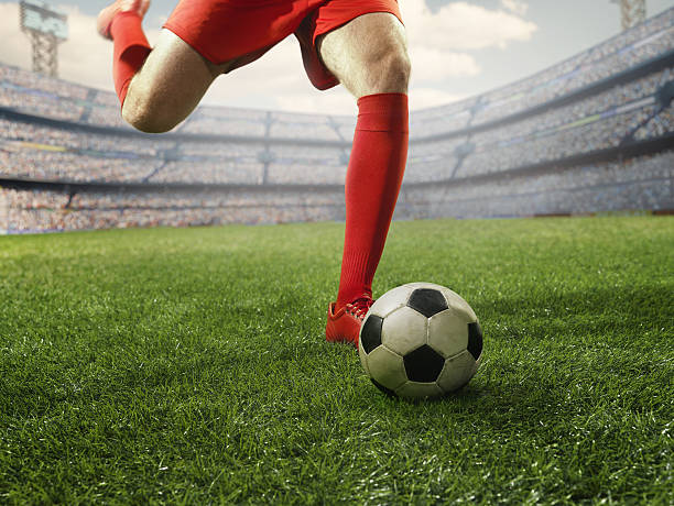 istock Soccer player kicking a ball 505989512