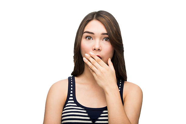 istock Young latin woman holding hand over mouth 505990132