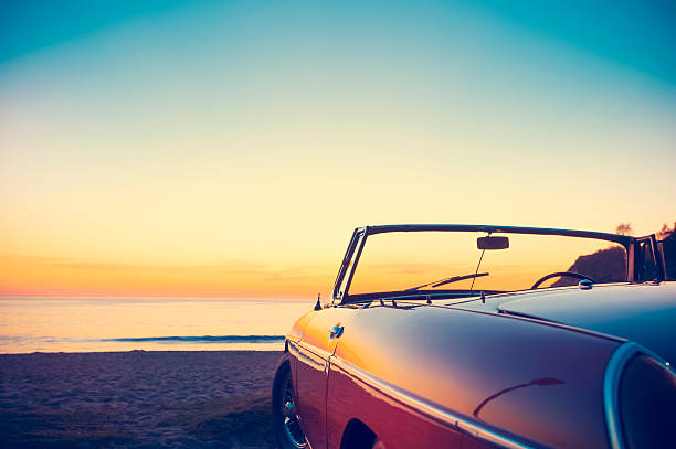 Travel, road trip and vintage with car at beach for adventure, transportation and summer vacation. Holiday destination,  mockup space and profile of motor vehicle in nature for journey and explore