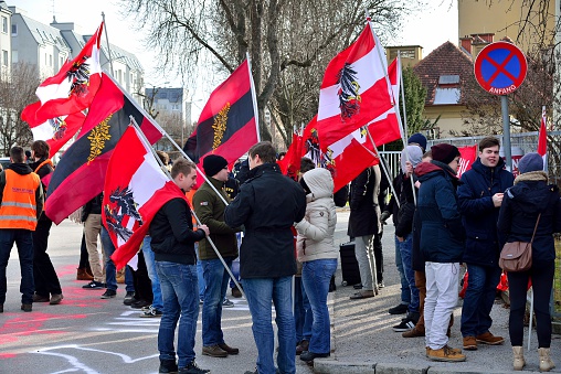 Graz / Austria - January 17, 2016: Protest rally by local residents against the construction of refugee shelters located in a residential area at Kirchner barracks in Graz. The protest rally was organized by a local initiative and the identitarian movement in Austria.