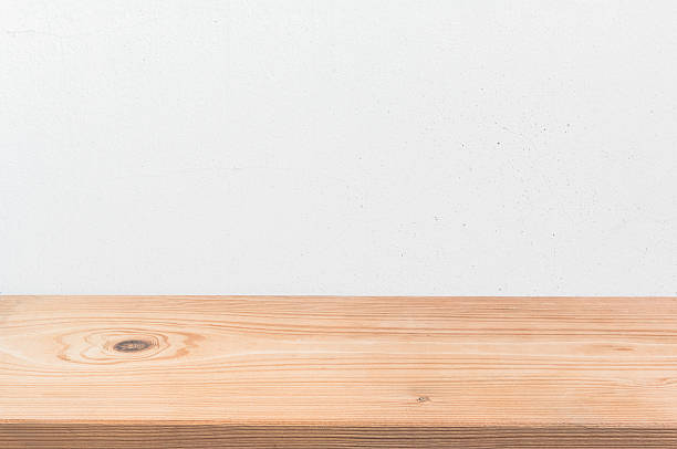 istock Empty wooden shelf over grunge cement wall 505991934