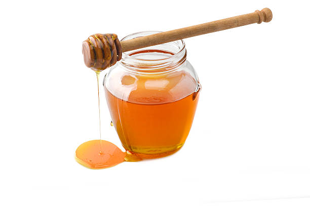 istock Glass jar of honey 505992892