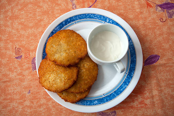 istock Potato pancake with sour cream 505994152