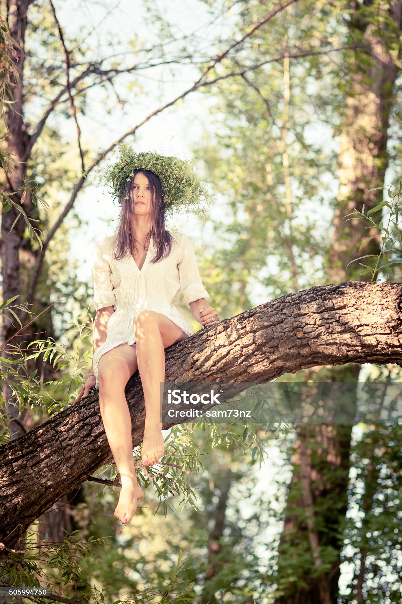 https://media.istockphoto.com/id/505994750/photo/beautiful-woman-sitting-on-tree-in-forest.jpg?s=2048x2048&amp;w=is&amp;k=20&amp;c=tmRBIzqpSPrcj3yfsG9Z2XM6TGE7sLpiSssqDb84dik=