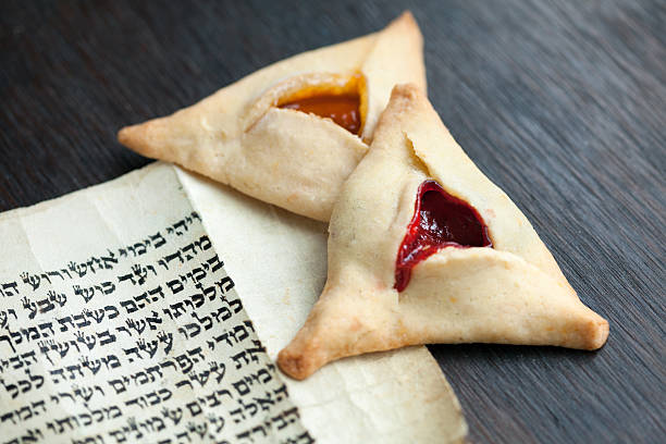 Purim Hamentashen and a megillah for Purim hebrew script photos stock pictures, royalty-free photos & images