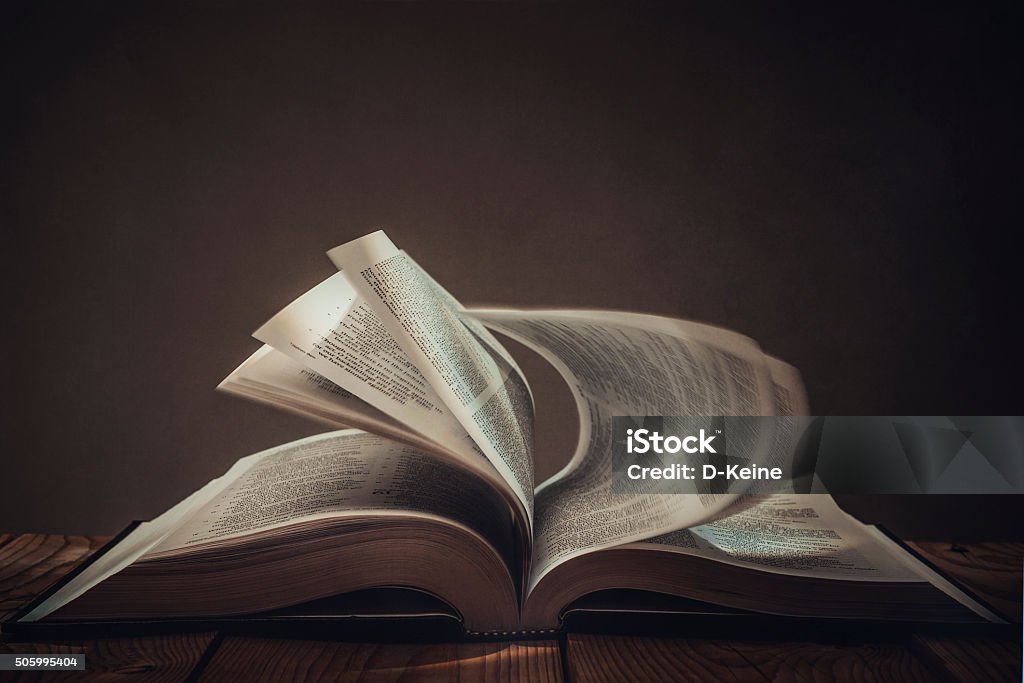 Book Open book with dark background Bible Stock Photo