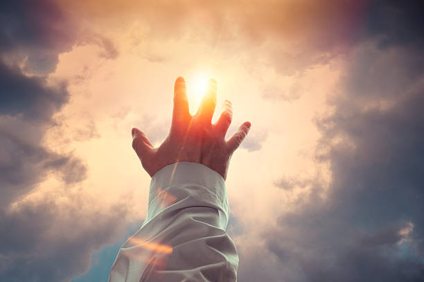 Blessing Male hand reaches a sunshine god and jesus stock pictures, royalty-free photos & images