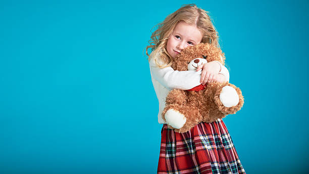 istock Fabulous little girl hugging brown teddy bear. 505996656