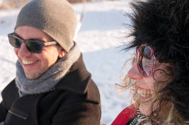 istock Couple Sitting On Bench In Winter 505996910